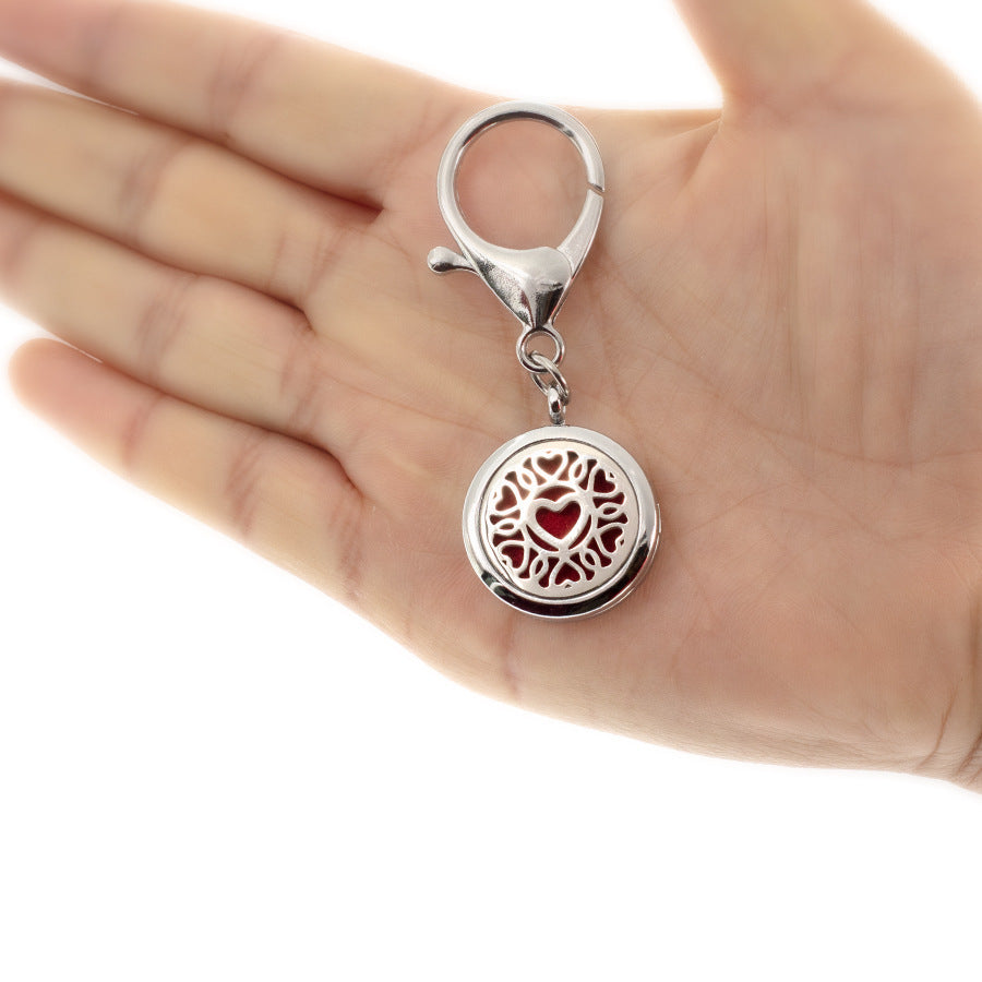 Wholesale 25MM Alloy Hollow New Flower Wings Aromatherapy Essential Oil Keychain